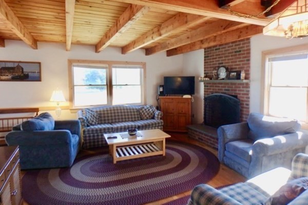 50 A Carl's Way West Tisbury, MA 02568 - Photo 4 of 19 a living room with furniture and a fireplace