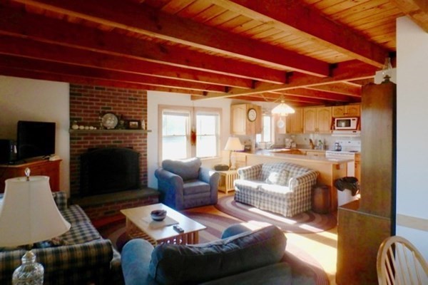 50 A Carl's Way West Tisbury, MA 02568 - Photo 7 of 19 a living room with furniture and a fireplace