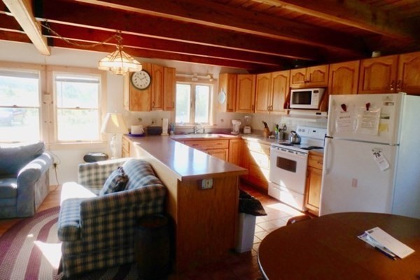 50 A Carl's Way West Tisbury, MA 02568 - Photo 9 of 19 a living room with stainless steel appliances furniture and a large window