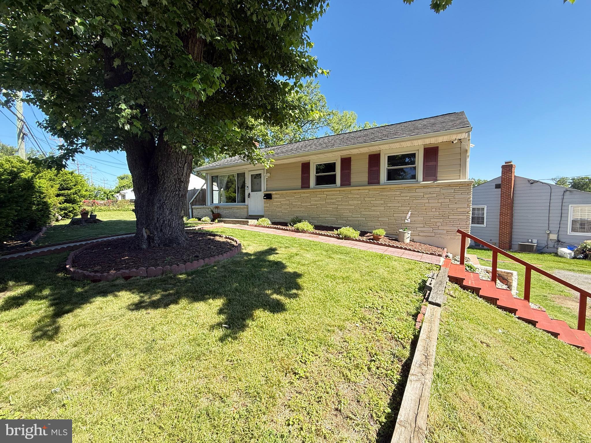 a front view of house with yard and swimming pool