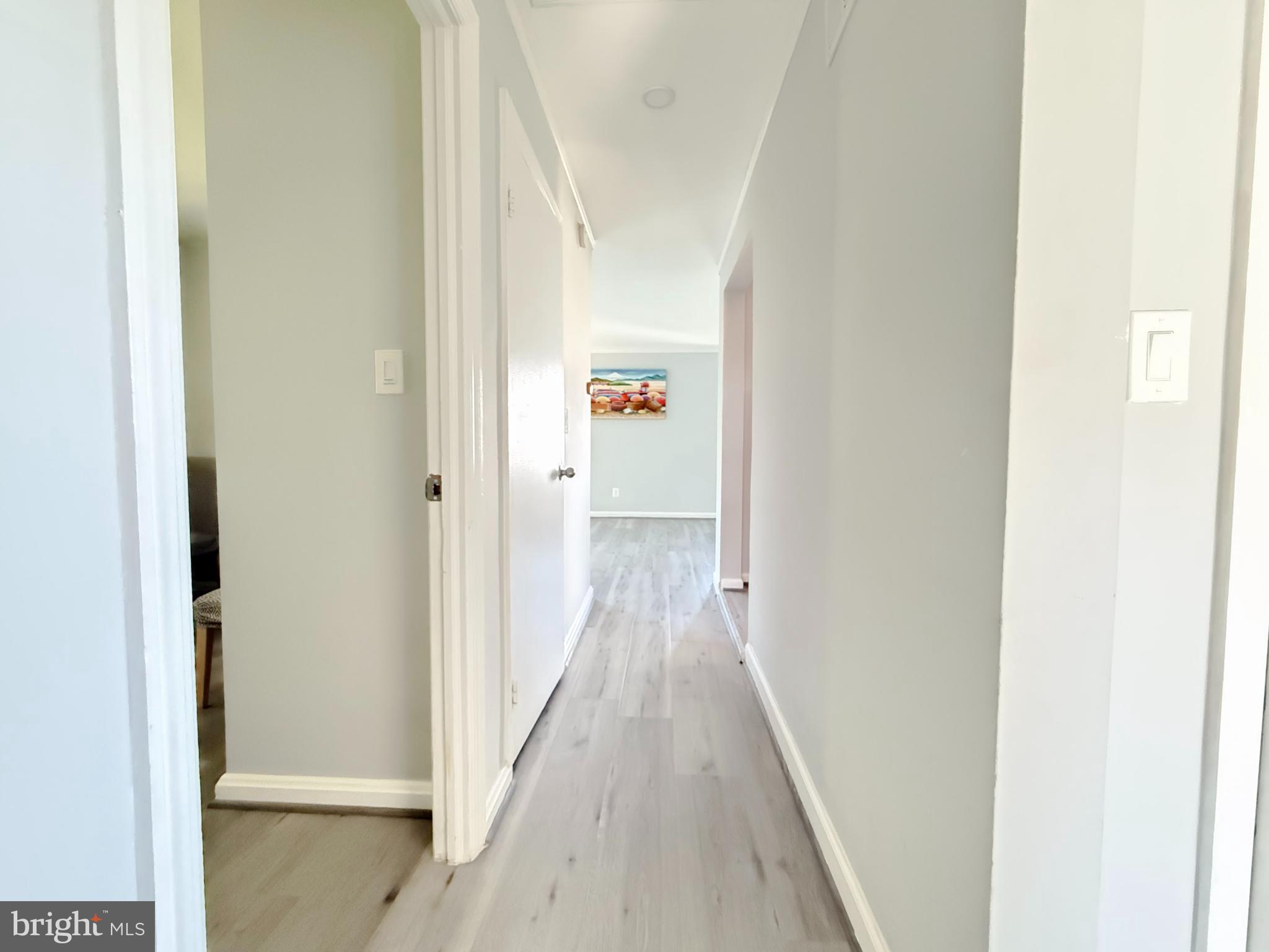 11601 Veirs Mill Road Wheaton, MD 20902 - Photo 11 of 30 a view of a hallway with wooden floor