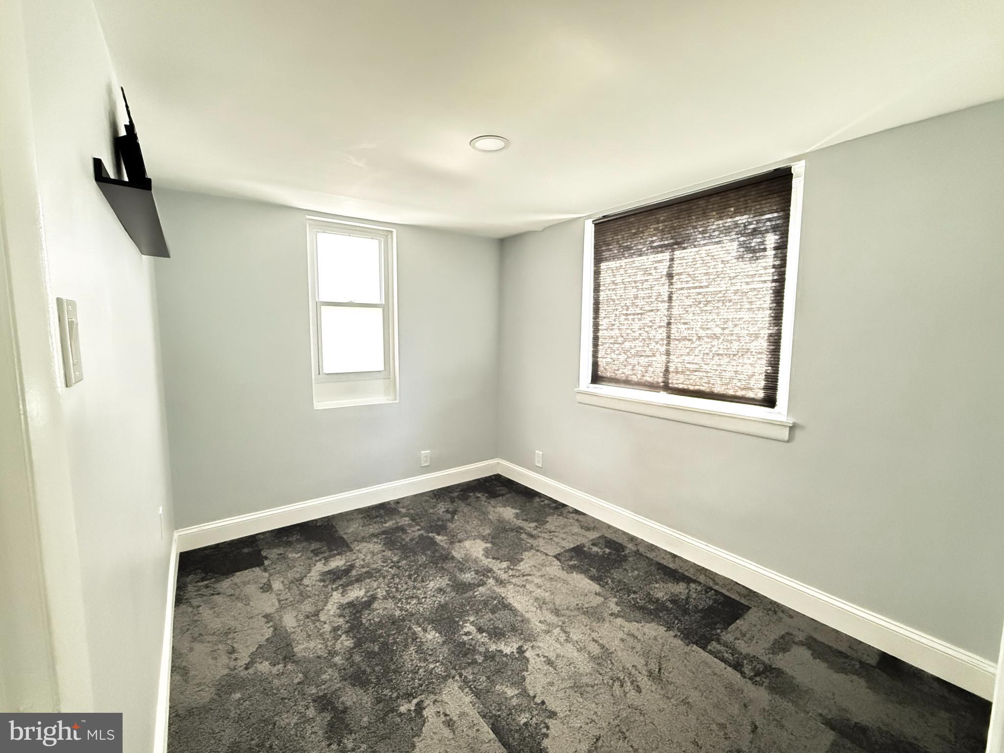 11601 Veirs Mill Road Wheaton, MD 20902 - Photo 20 of 30 a view of an empty room with a window