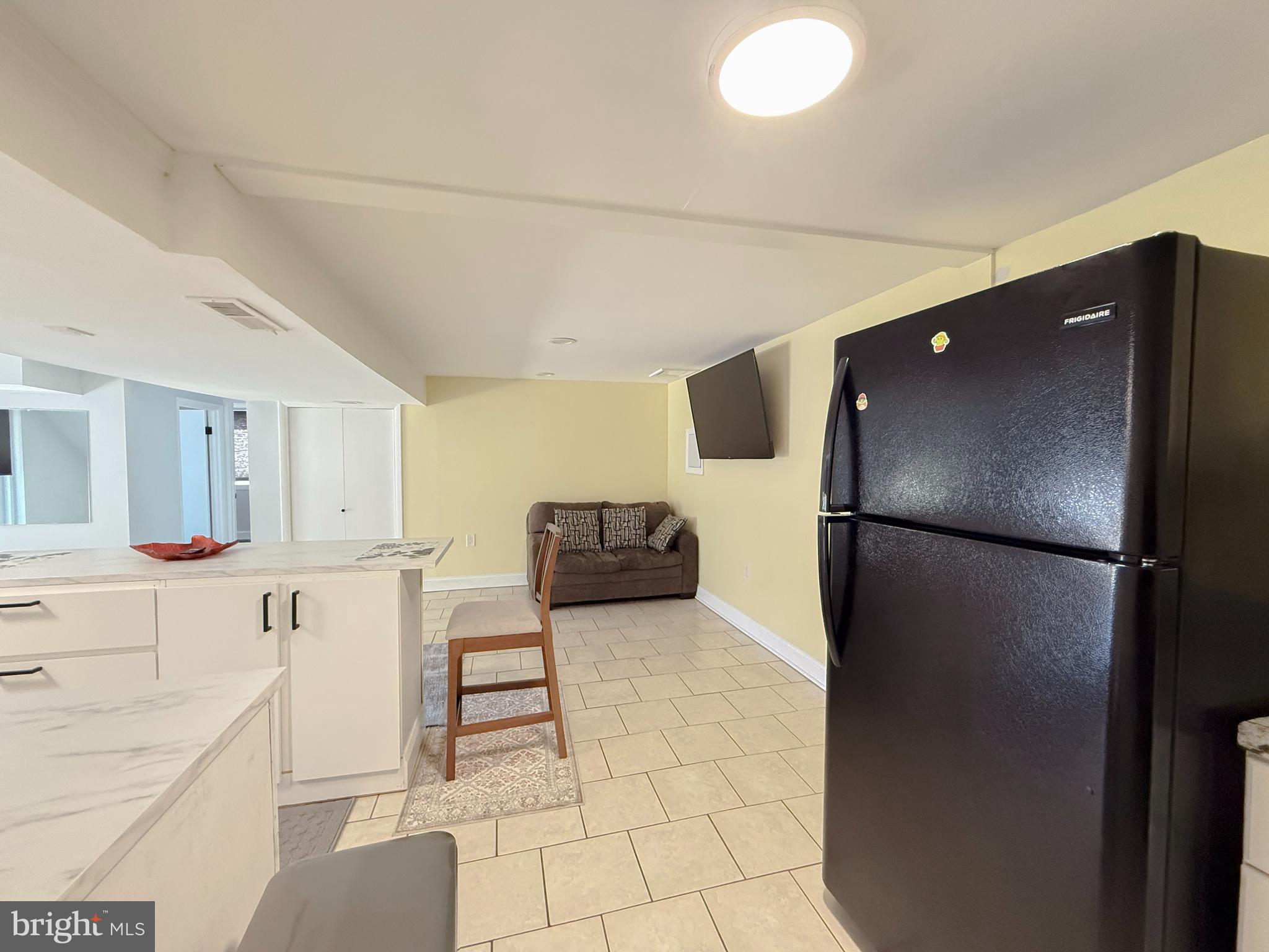 11601 Veirs Mill Road Wheaton, MD 20902 - Photo 25 of 30 a kitchen with stainless steel appliances a refrigerator and a stove top oven