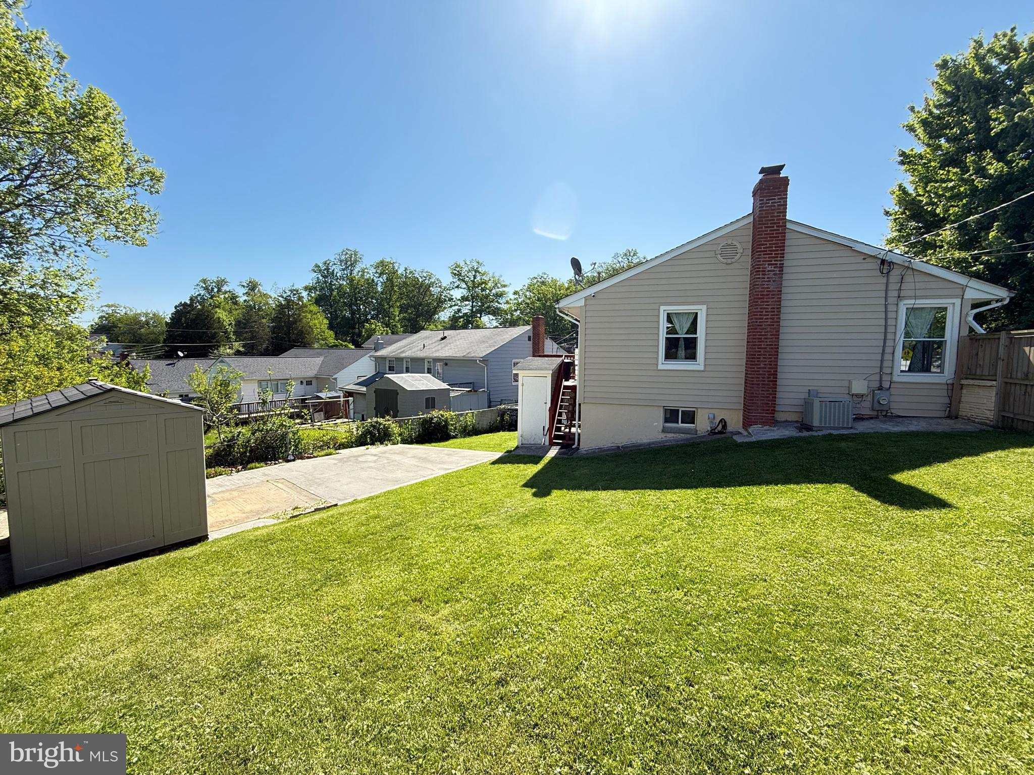 11601 Veirs Mill Road Wheaton, MD 20902 - Photo 29 of 30 a view of a house with pool and a yard