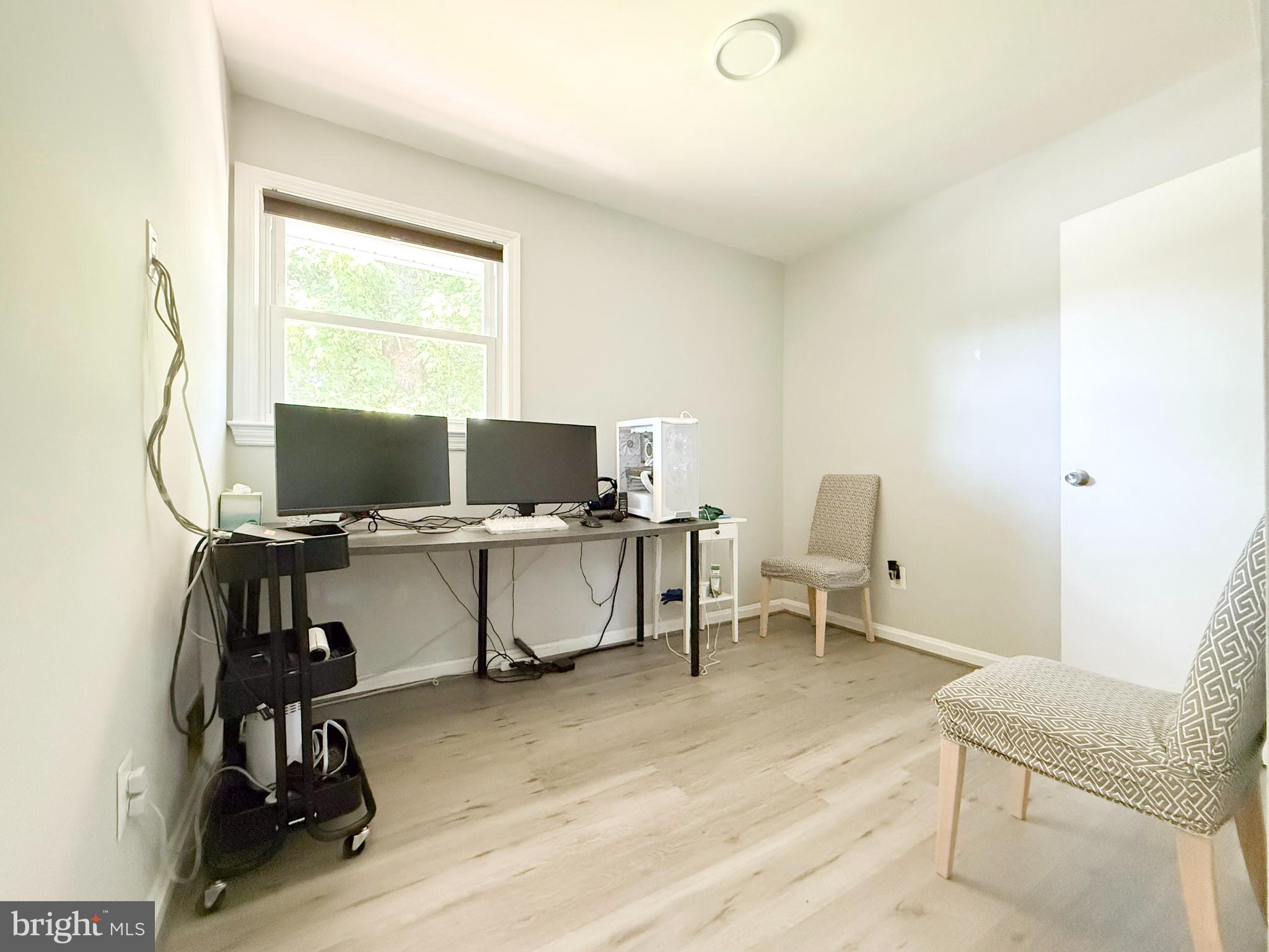 11601 Veirs Mill Road Wheaton, MD 20902 - Photo 7 of 30 a view of a workspace with furniture and a window