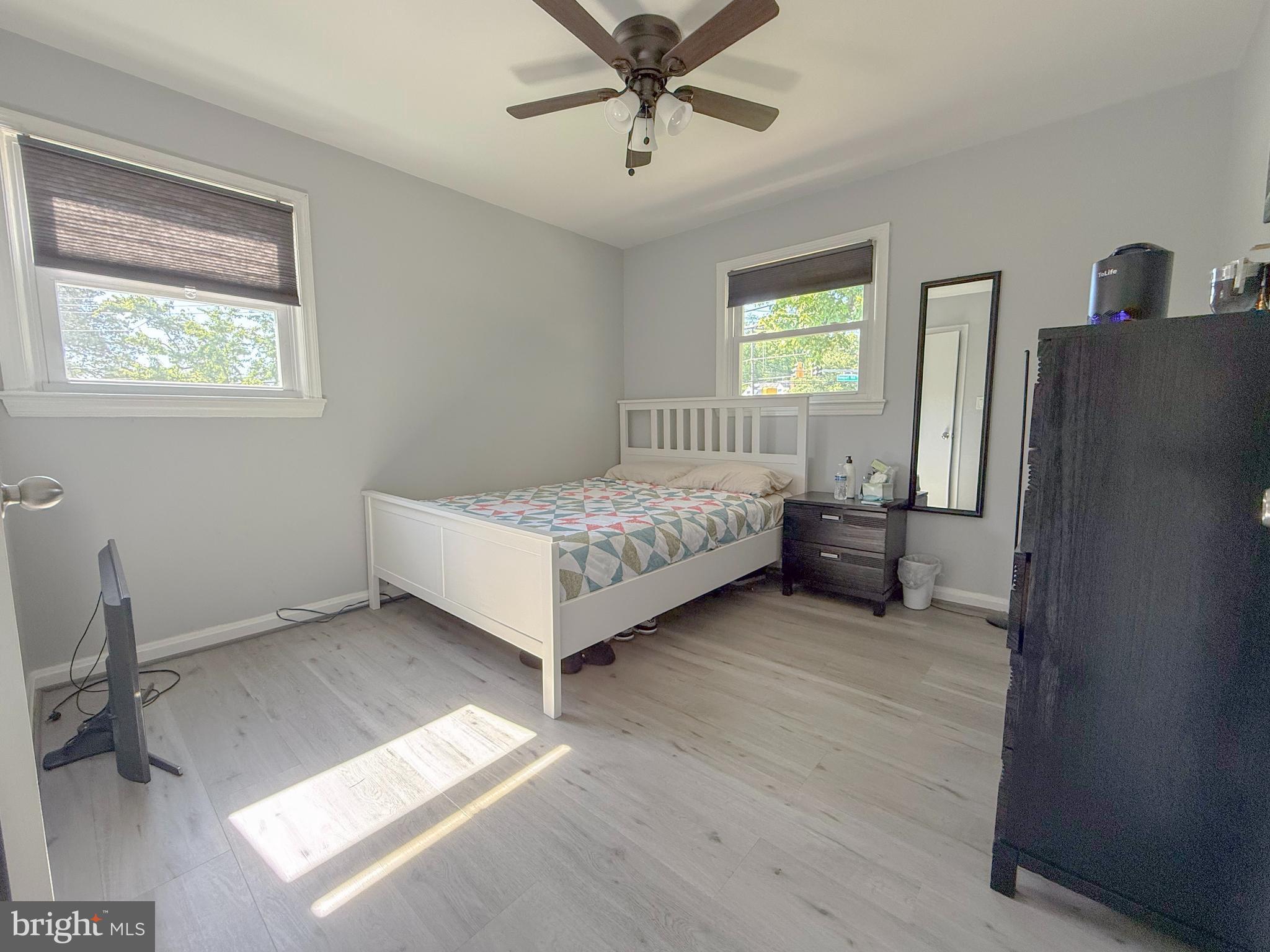 11601 Veirs Mill Road Wheaton, MD 20902 - Photo 8 of 30 a bedroom with a bed and a window