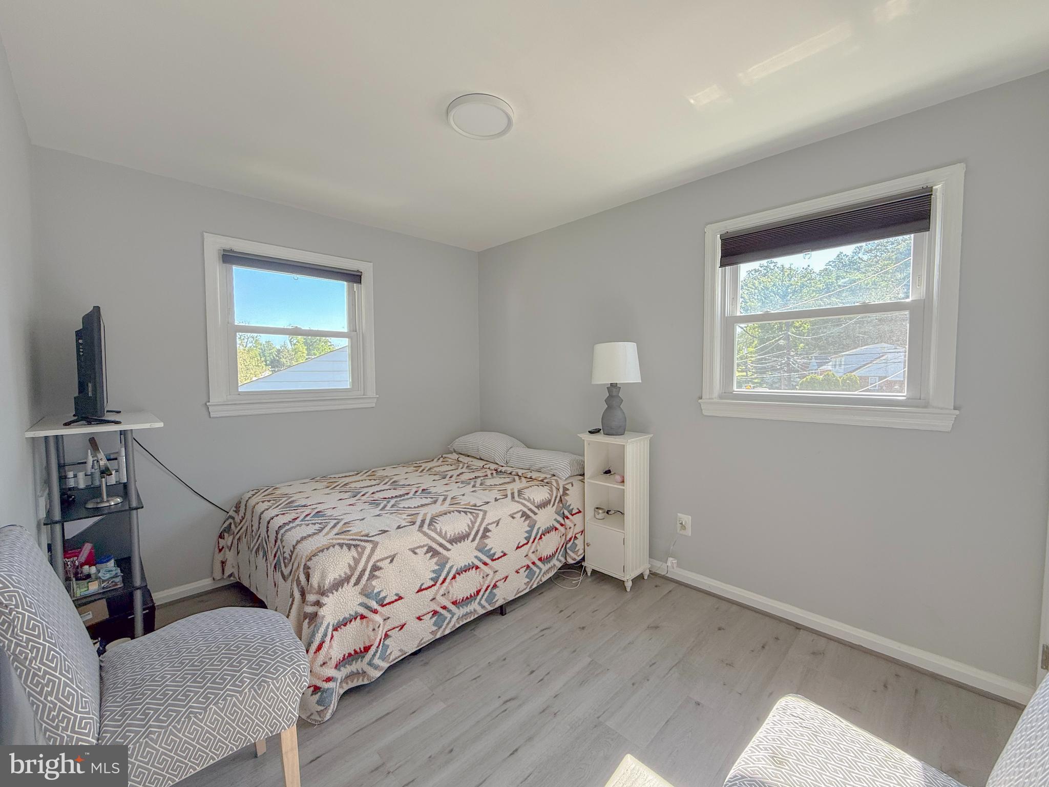 11601 Veirs Mill Road Wheaton, MD 20902 - Photo 9 of 30 a bedroom with a bed and a window