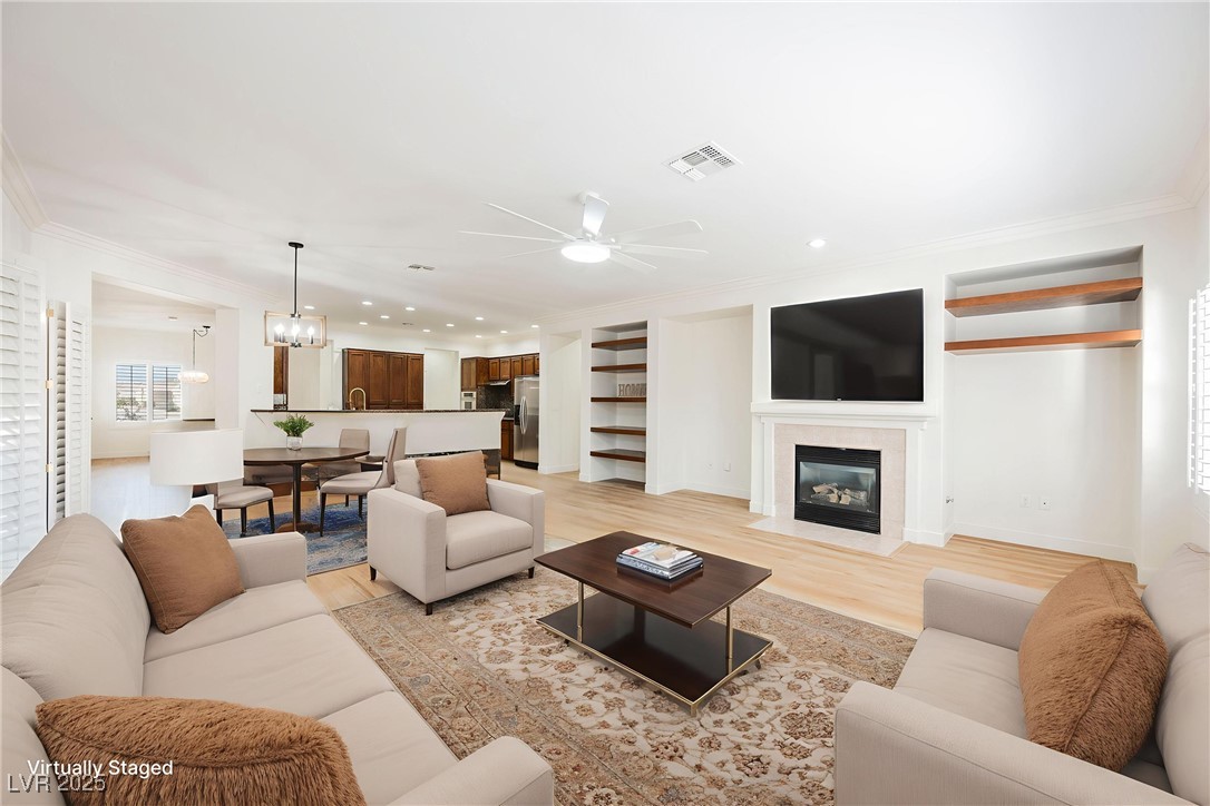 1596 Fieldbrook Street Henderson, NV 89052 - Photo 56 of 56 Virtually staged family room showing informal dining and kitchen, a wonderful open floor plan for everyday living and entertaining.