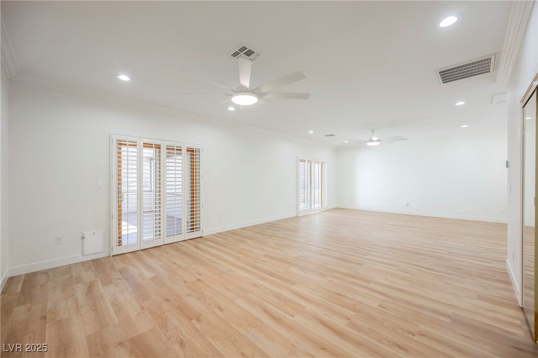 1596 Fieldbrook Street Henderson, NV 89052 - Photo 18 of 56 Spacious primary bedroom with access to enclosed patio outdoor living space.