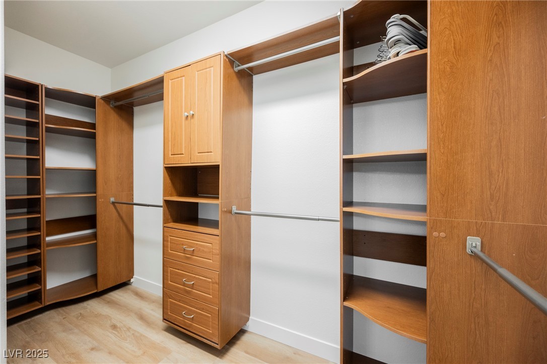 1596 Fieldbrook Street Henderson, NV 89052 - Photo 23 of 56 Custom walk-in closet in primary suite. There are 2 additional closets in primary bedroom for extra storage.