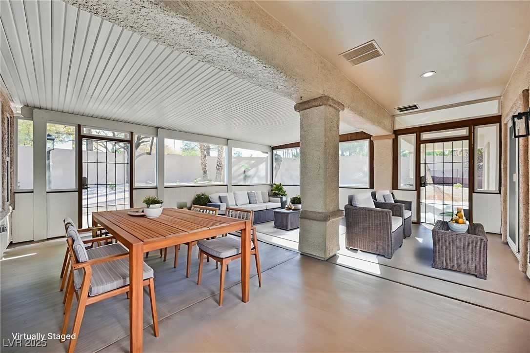 1596 Fieldbrook Street Henderson, NV 89052 - Photo 24 of 56 Virtually staged, fully enclosed sun room gives additional 460 sf of living space. Great for entertaining, morning coffee, quiet retreat or game room...endless possibilities!