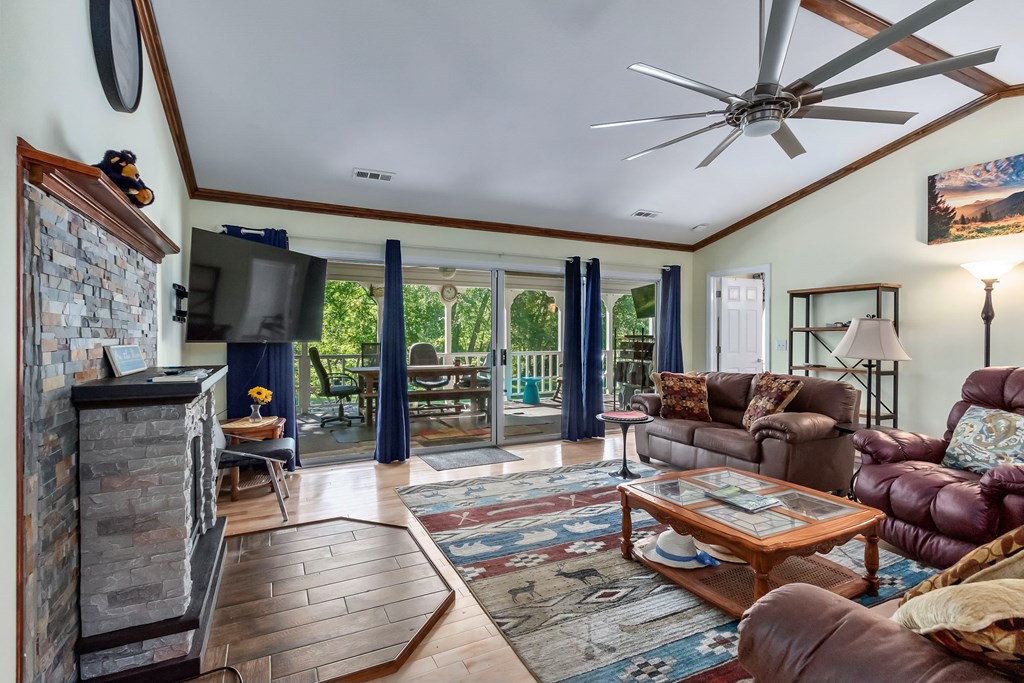 615 Little Ranger Road Murphy, NC 28906 - Photo 24 of 97 a living room with furniture a flat screen tv and a large window