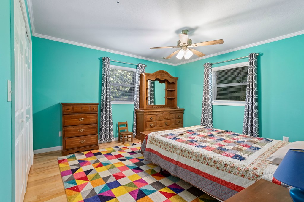 615 Little Ranger Road Murphy, NC 28906 - Photo 44 of 97 a bedroom with a bed and a dresser in it