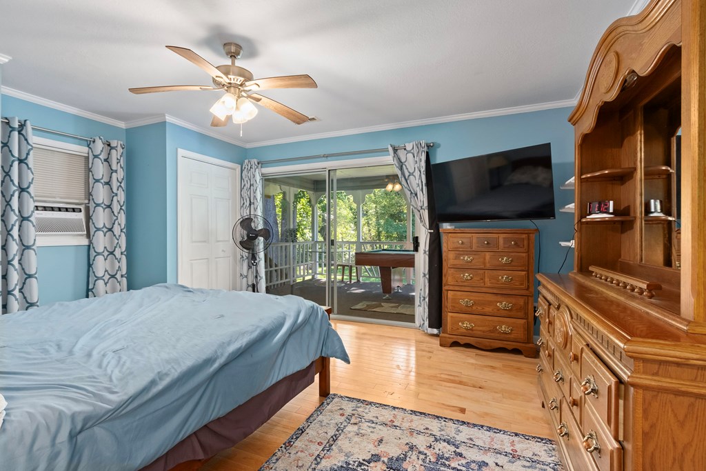 615 Little Ranger Road Murphy, NC 28906 - Photo 49 of 97 a bedroom with a bed and a flat screen tv