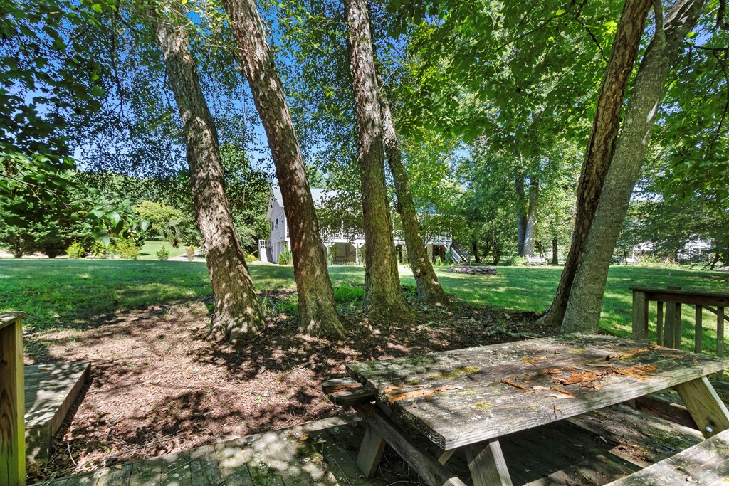 615 Little Ranger Road Murphy, NC 28906 - Photo 87 of 97 a view of a wooden dinning table and chairs in the garden