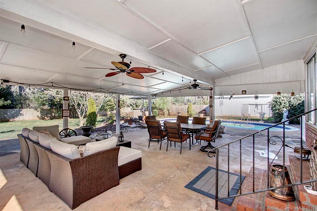a view of a patio with a table and chairs