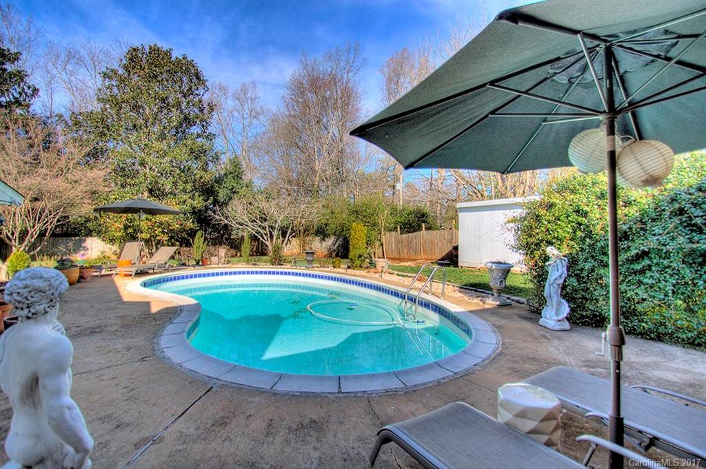 918 Lansdowne Road Charlotte, NC 28270 - Photo 2 of 24 a view of a swimming pool with a patio