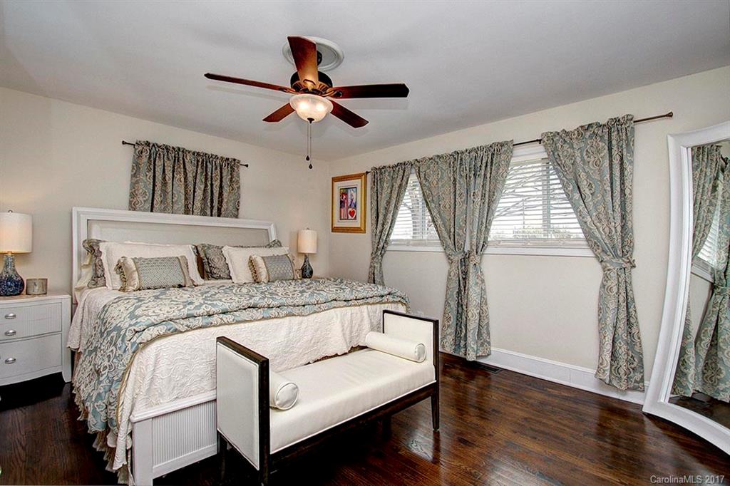 918 Lansdowne Road Charlotte, NC 28270 - Photo 14 of 24 a bedroom with a large bed and a window