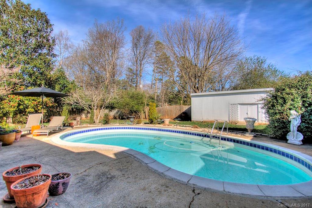 918 Lansdowne Road Charlotte, NC 28270 - Photo 21 of 24 a view of a house with swimming pool and sitting area
