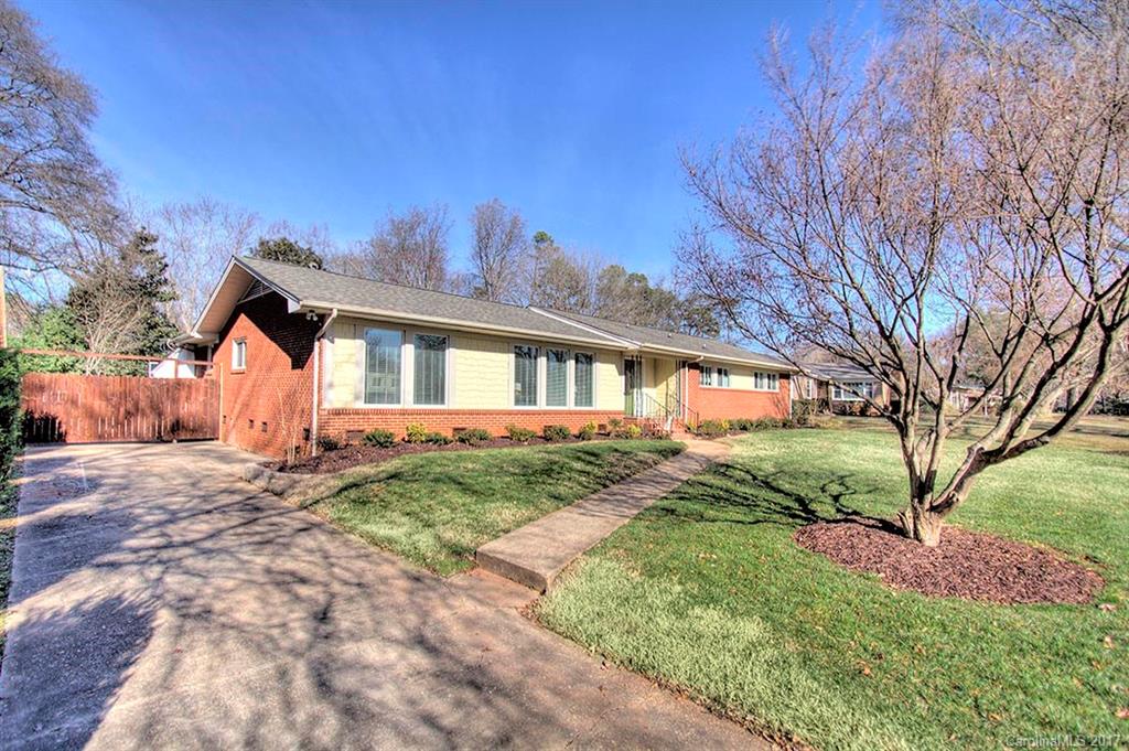 918 Lansdowne Road Charlotte, NC 28270 - Photo 22 of 24 a front view of a house with a yard