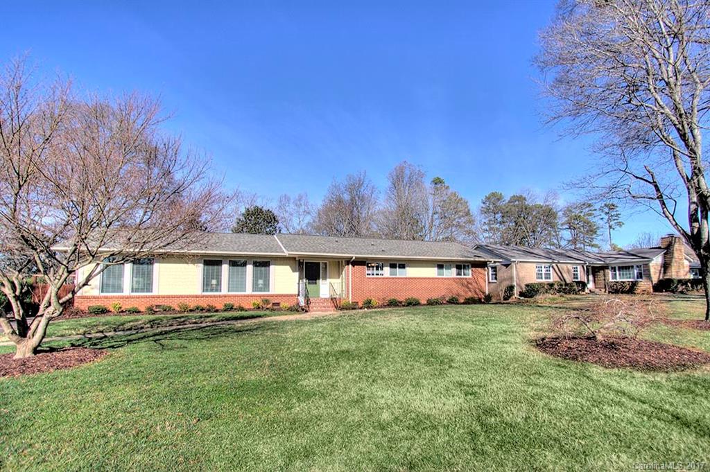 918 Lansdowne Road Charlotte, NC 28270 - Photo 23 of 24 a view of a house with a big yard and large trees