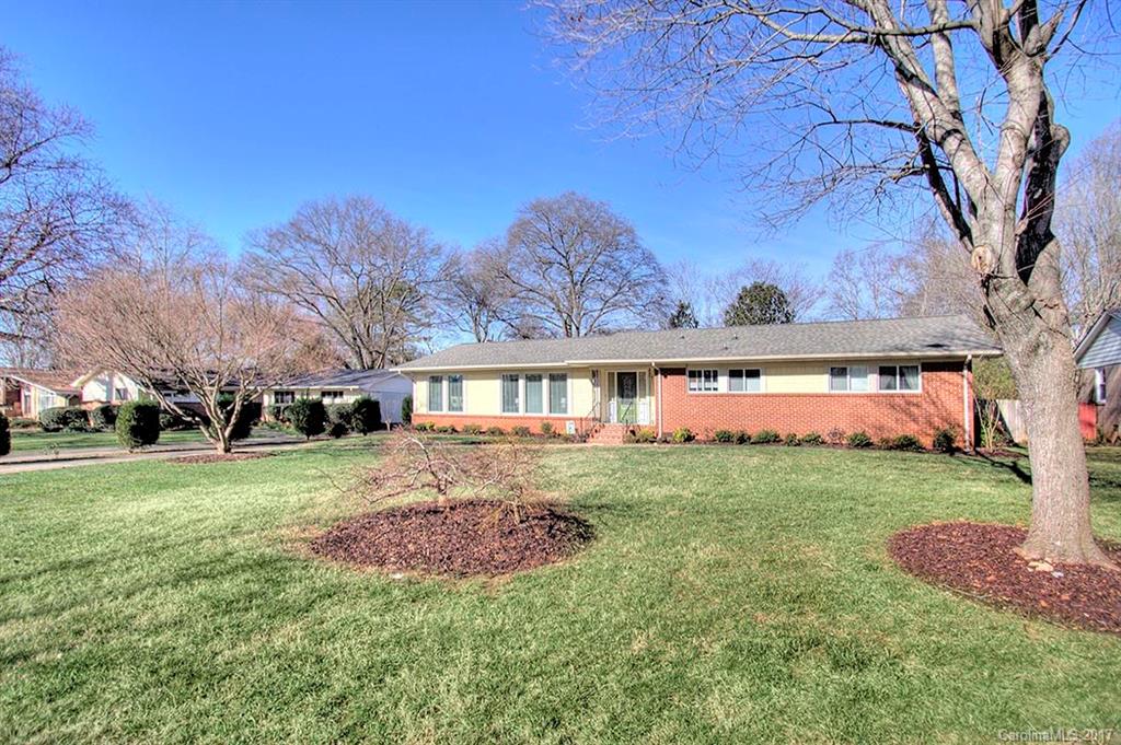 918 Lansdowne Road Charlotte, NC 28270 - Photo 24 of 24 a front view of a house with a garden