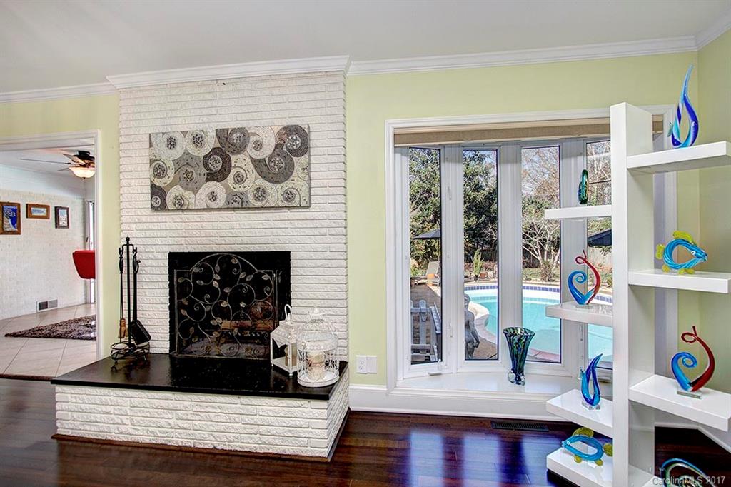 918 Lansdowne Road Charlotte, NC 28270 - Photo 8 of 24 a living room with furniture and a fireplace