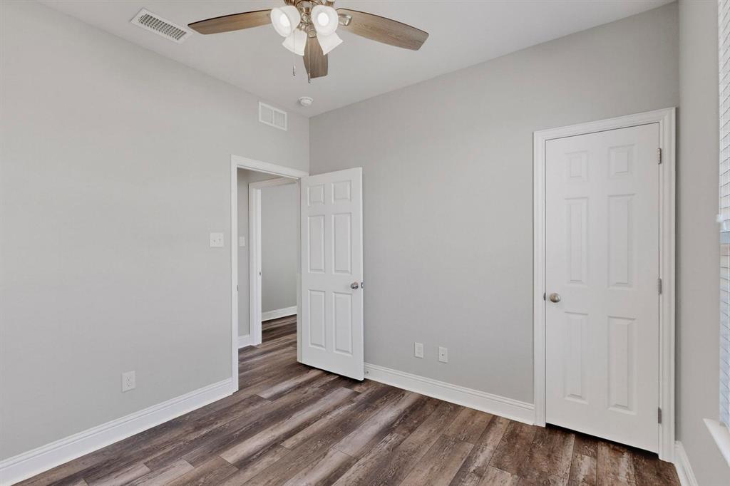 634 Gant Road Sherman, TX 75090 - Photo 29 of 40 Unfurnished bedroom with dark wood-type flooring and ceiling fan