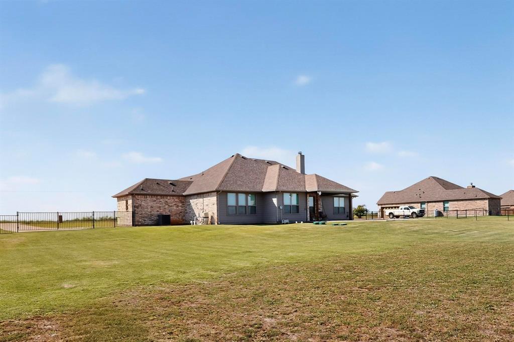 634 Gant Road Sherman, TX 75090 - Photo 37 of 40 Rear view of property featuring a chimney and brick siding