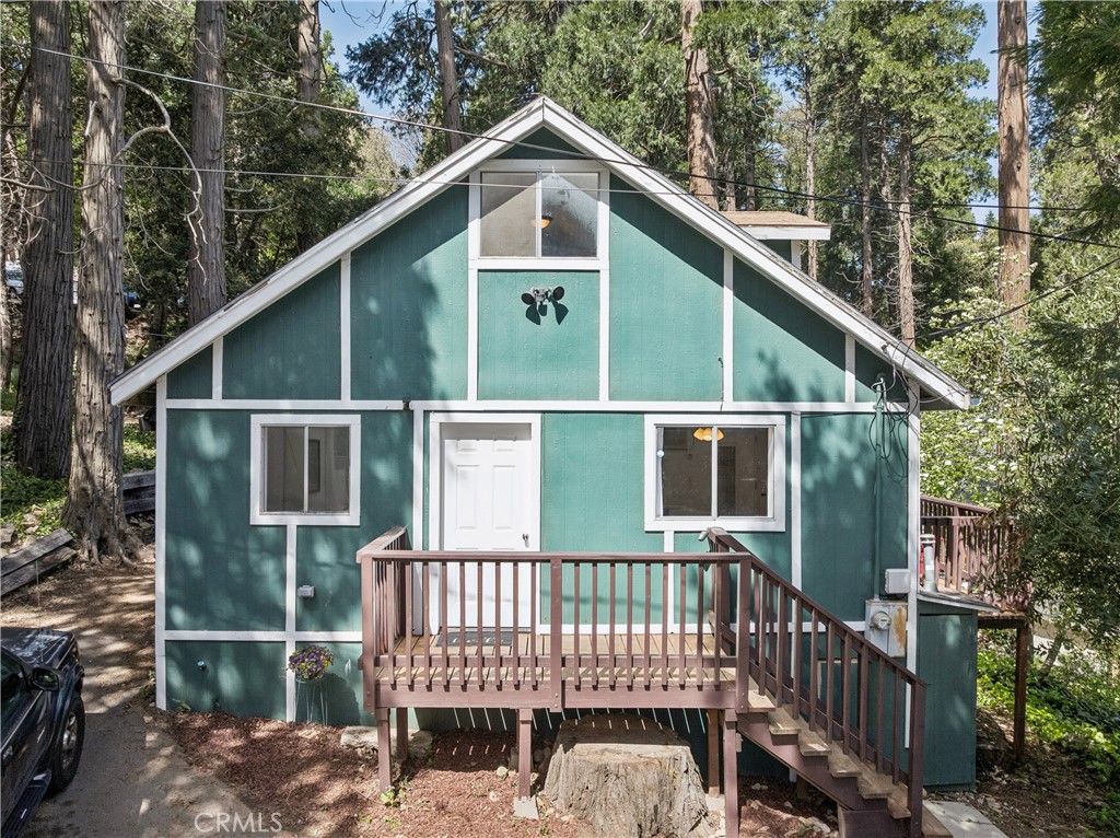 a view of a wooden deck and a yard