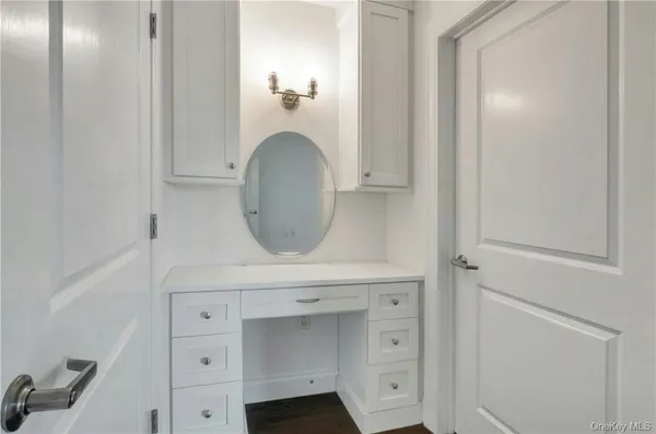 a bathroom with a sink and mirror