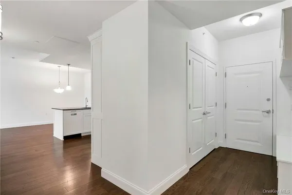 an empty room with wooden floor
