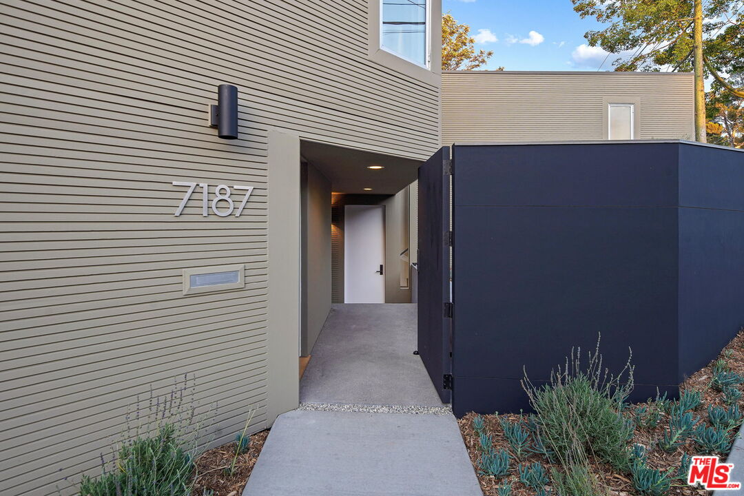 7187 Macapa Drive Los Angeles, CA 90068 - Photo 12 of 39 a view of a house with a garage