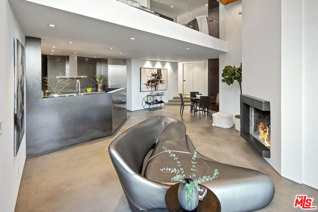 7187 Macapa Drive Los Angeles, CA 90068 - Photo 14 of 39 a living room with furniture and a fireplace