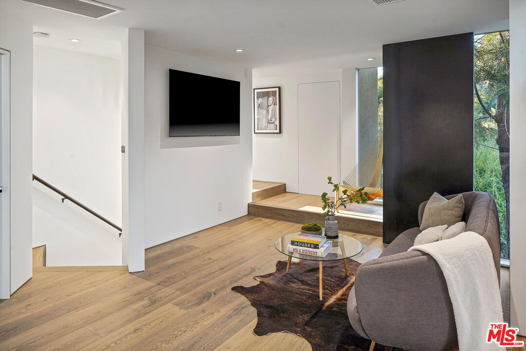 7187 Macapa Drive Los Angeles, CA 90068 - Photo 18 of 39 a living room with furniture and a flat screen tv