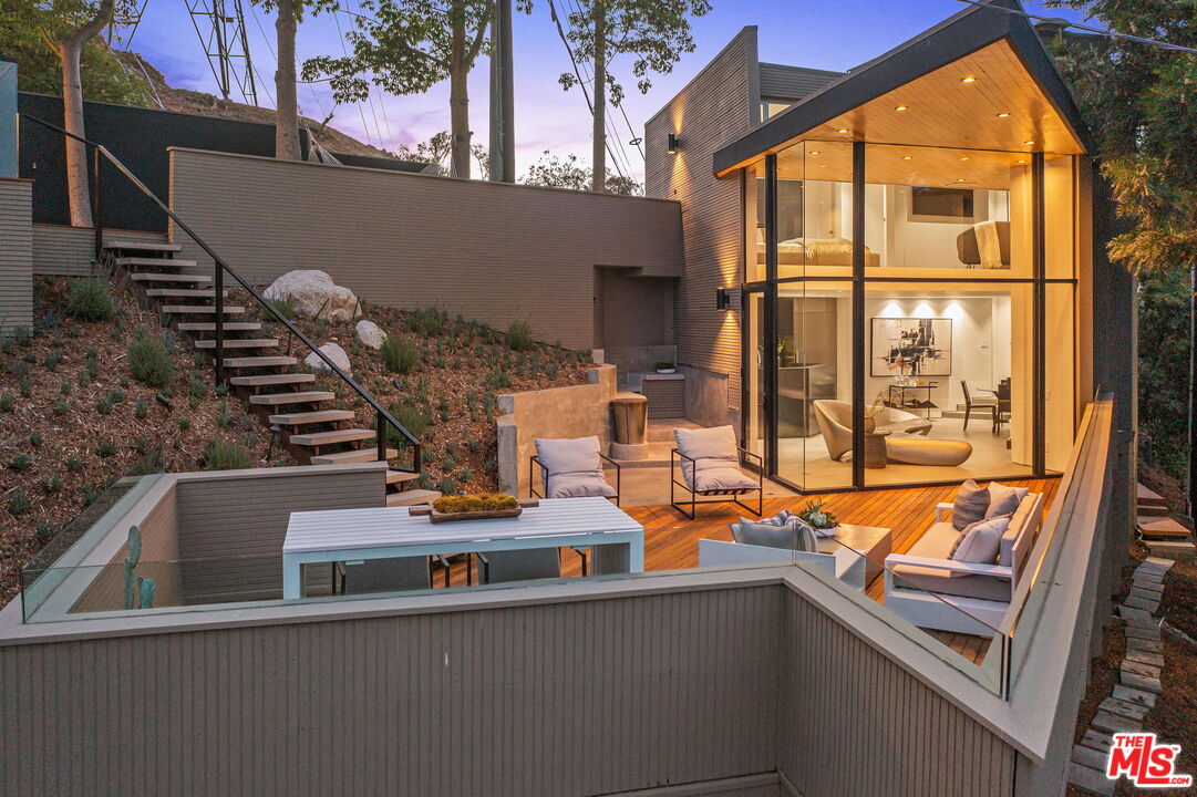 7187 Macapa Drive Los Angeles, CA 90068 - Photo 2 of 39 a view of entryway and hall with wooden floor