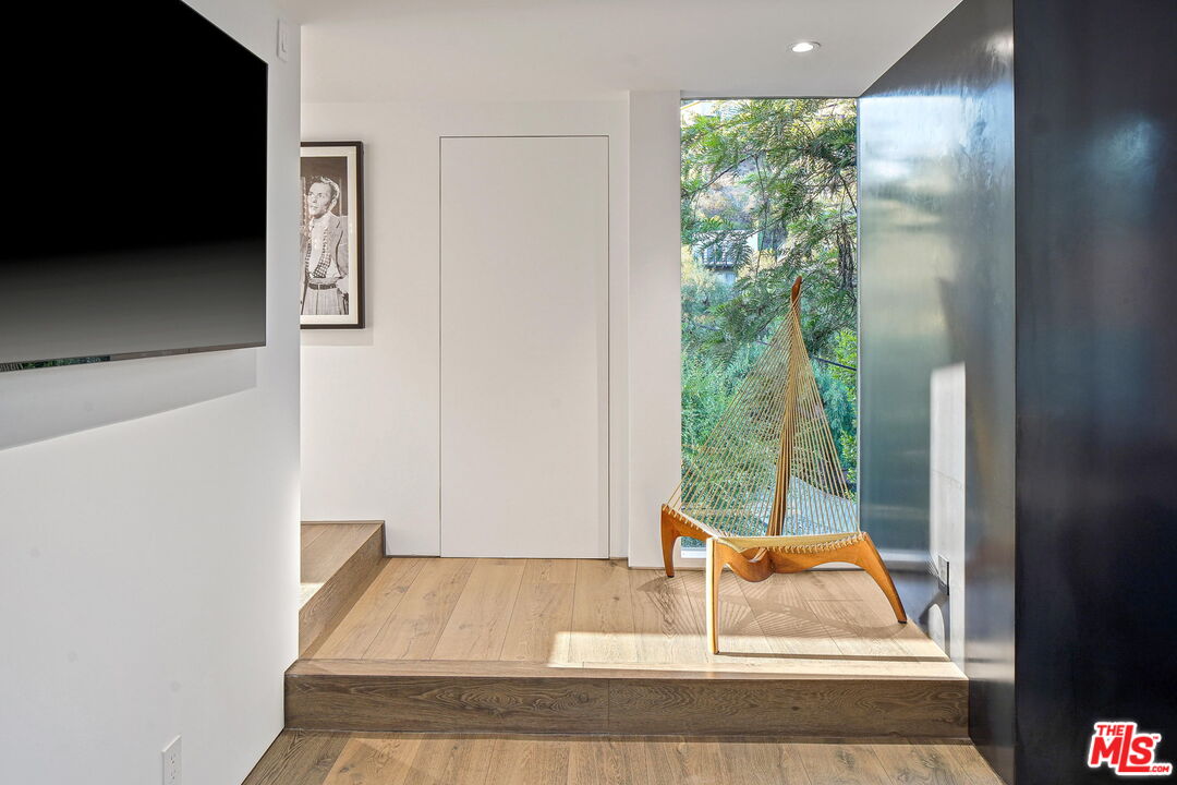 7187 Macapa Drive Los Angeles, CA 90068 - Photo 21 of 39 a living room with a bed and a coffee table