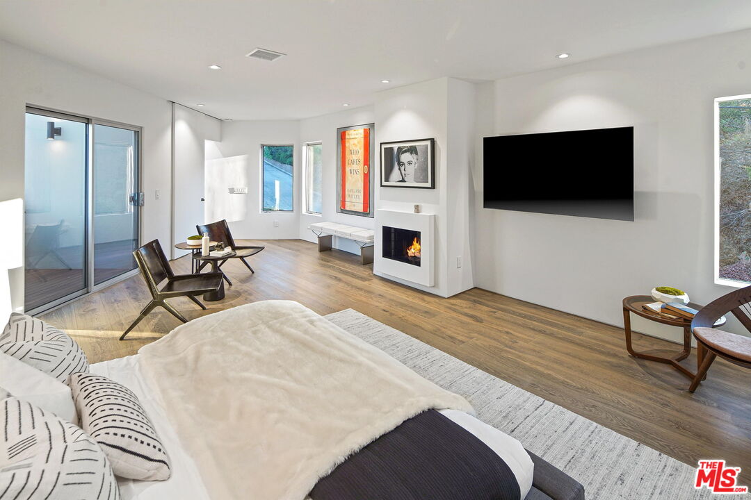 7187 Macapa Drive Los Angeles, CA 90068 - Photo 23 of 39 a living room with furniture and a flat screen tv