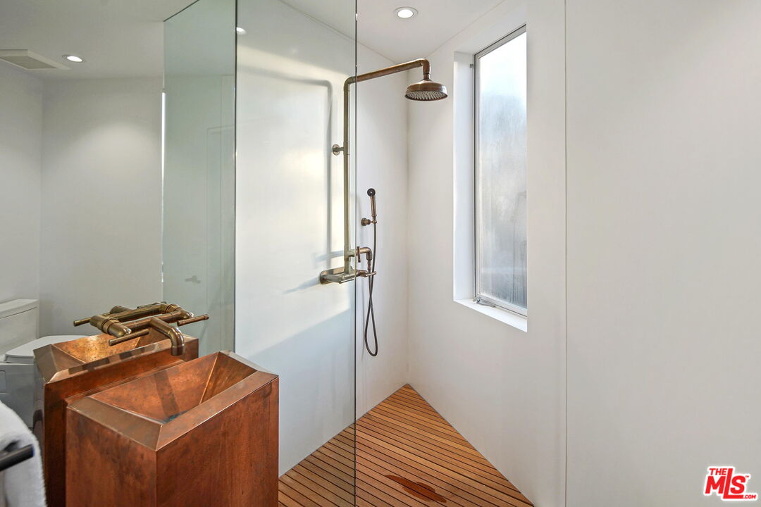 7187 Macapa Drive Los Angeles, CA 90068 - Photo 27 of 39 a bathroom with a sink toilet and shower