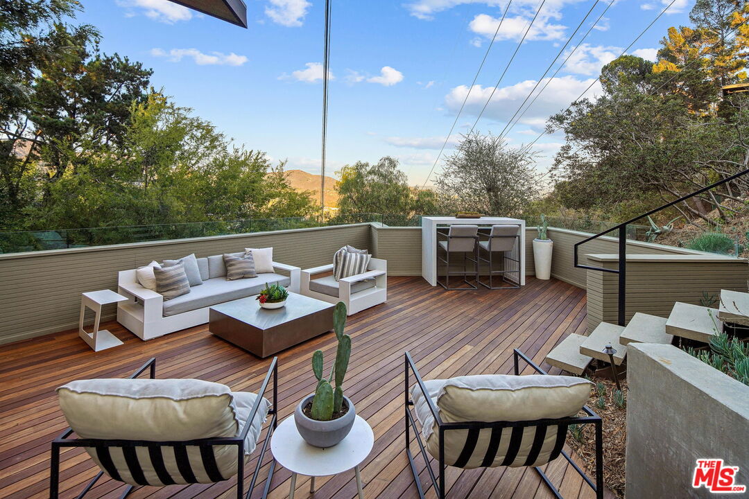 7187 Macapa Drive Los Angeles, CA 90068 - Photo 28 of 39 a patio with couch and chairs