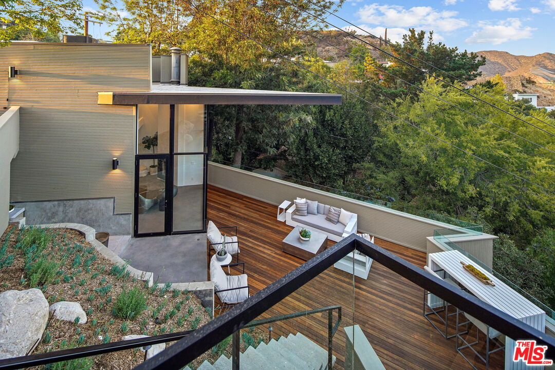 7187 Macapa Drive Los Angeles, CA 90068 - Photo 29 of 39 a view of balcony with furniture
