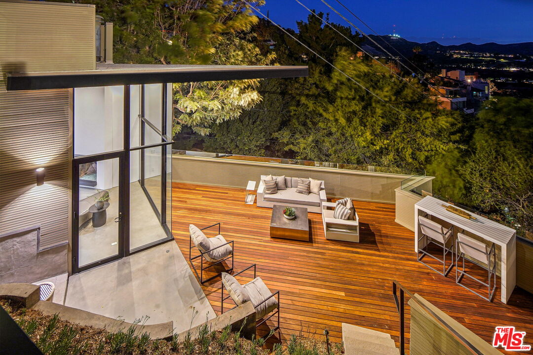 7187 Macapa Drive Los Angeles, CA 90068 - Photo 3 of 39 swimming pool view with a seating space