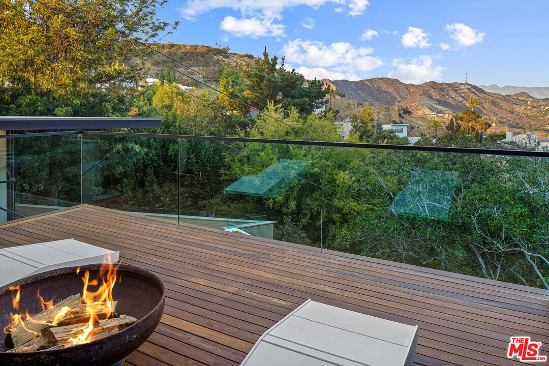 7187 Macapa Drive Los Angeles, CA 90068 - Photo 4 of 39 a view of a balcony with mountain view