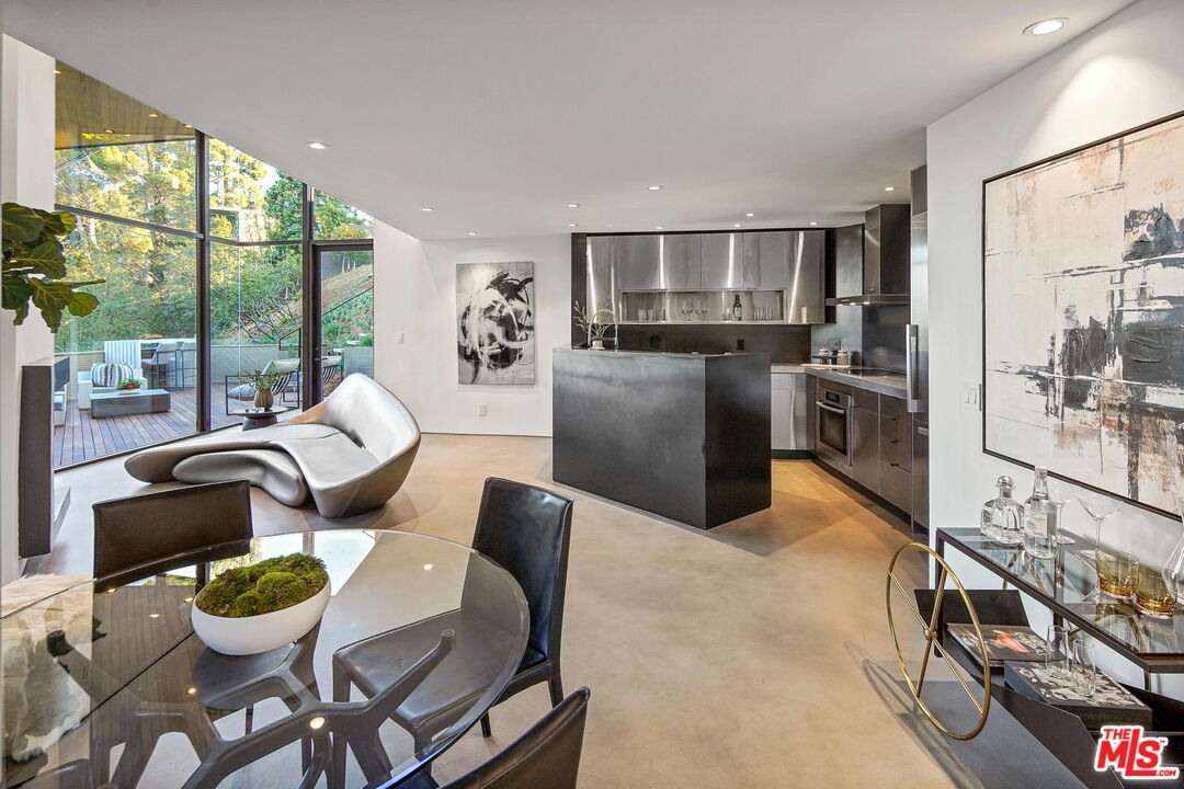 7187 Macapa Drive Los Angeles, CA 90068 - Photo 5 of 39 a dining room with furniture and large windows