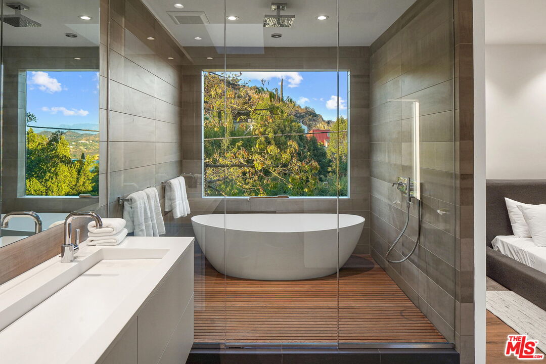 7187 Macapa Drive Los Angeles, CA 90068 - Photo 9 of 39 a living room with a couch and a table