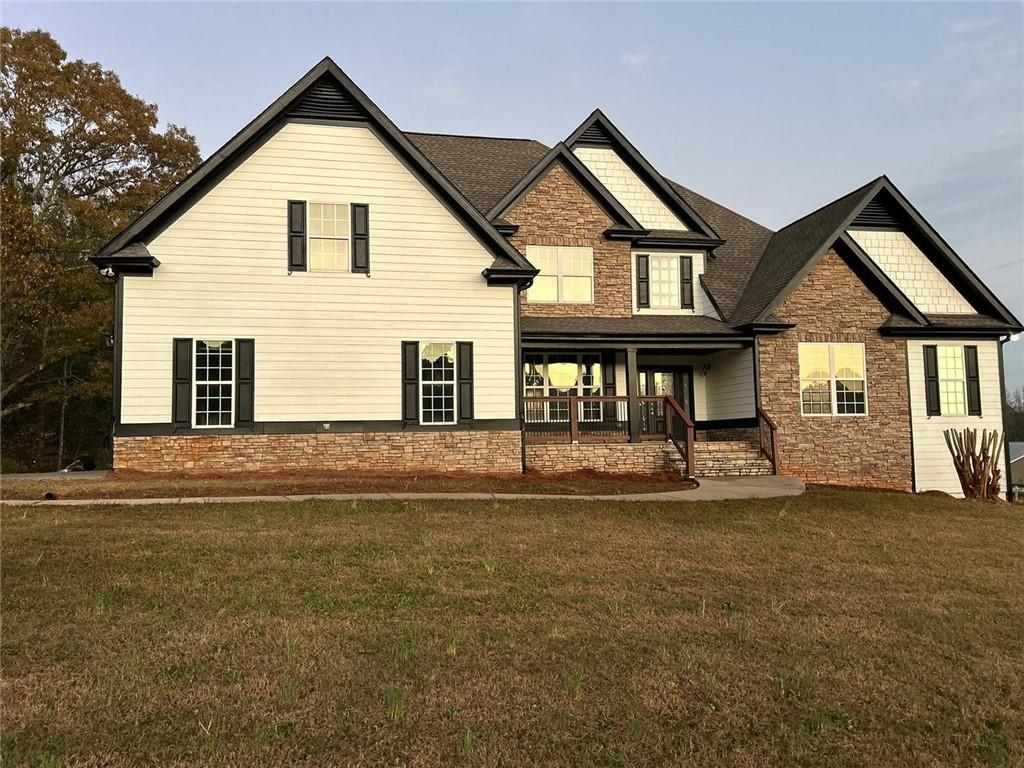 a front view of a house with a yard