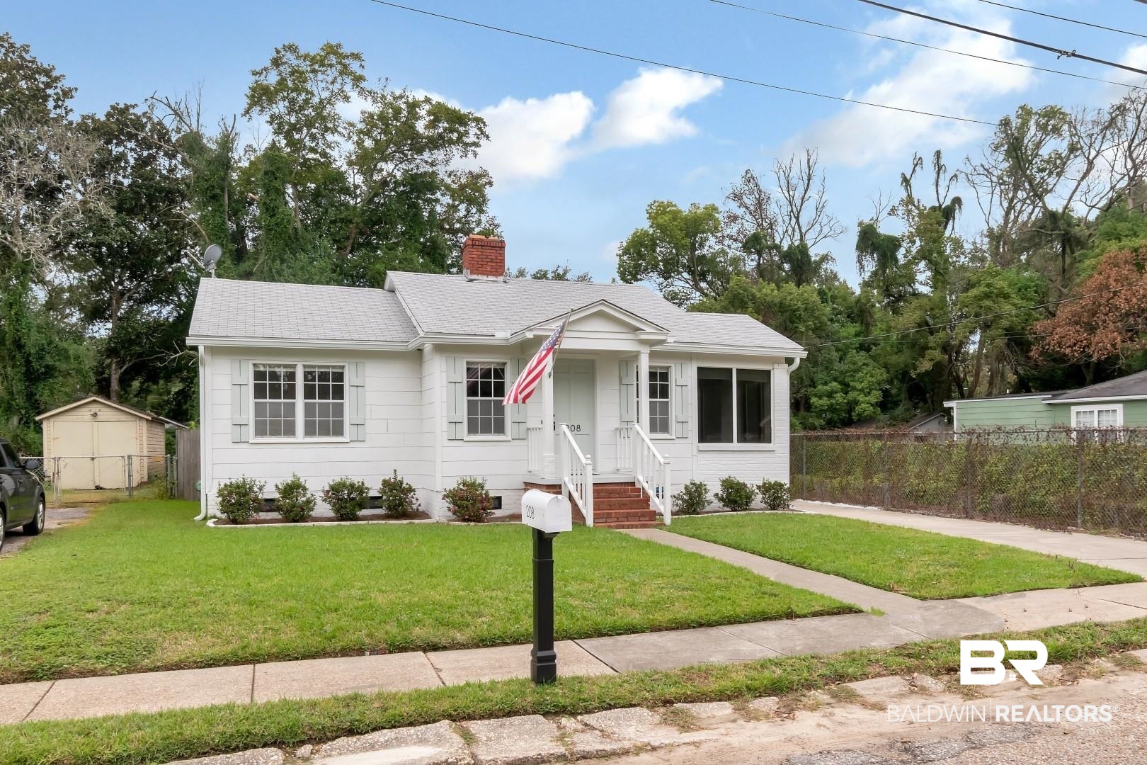 208 Morgan Avenue Mobile, AL 36606 - Photo 4 of 27 View of front of house featuring a storage shed and a front lawn