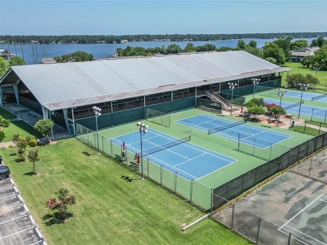 a view of a backyard with a patio and fire pit