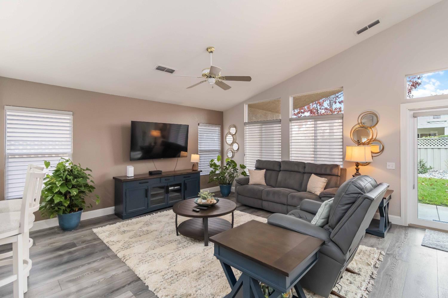 7597 Timberrose Way Roseville, CA 95747 - Photo 13 of 30 a living room with furniture and a flat screen tv