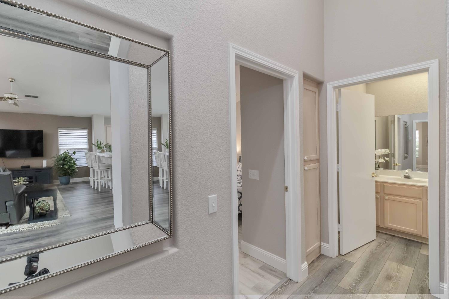 7597 Timberrose Way Roseville, CA 95747 - Photo 18 of 30 a bathroom with a mirror and a shower